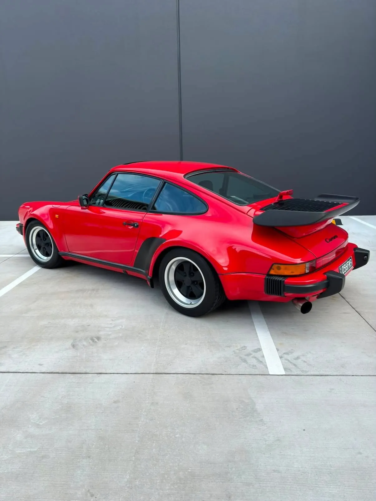 Classic red Porsche 930 Turbo at Onyx Prestige